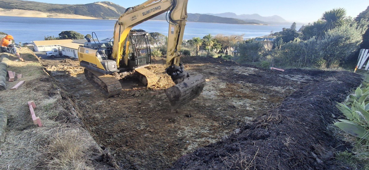 Excavator cutting a site